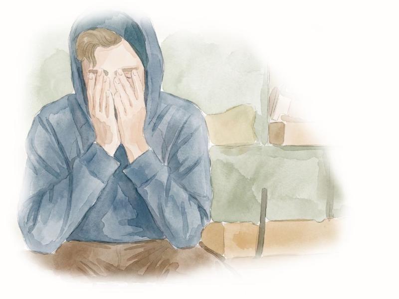 Tired man sitting on a coach